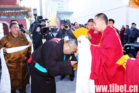 Jamyang Losangjigme Tubdainqoigyi Nyima (L2), president of the High-level Tibetan Buddhism College of China, presents a hada to the 11th Panchen Lama Bainqen Erdini Qoigyijabu in Beijing on Monday, Nov. 2, 2009. 